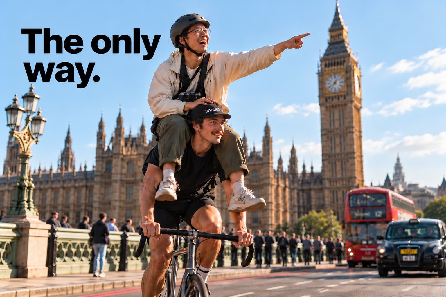 A tourist riding on the shoulders of a cyclist crossing Westminster Bridge, Big Ben behind them.